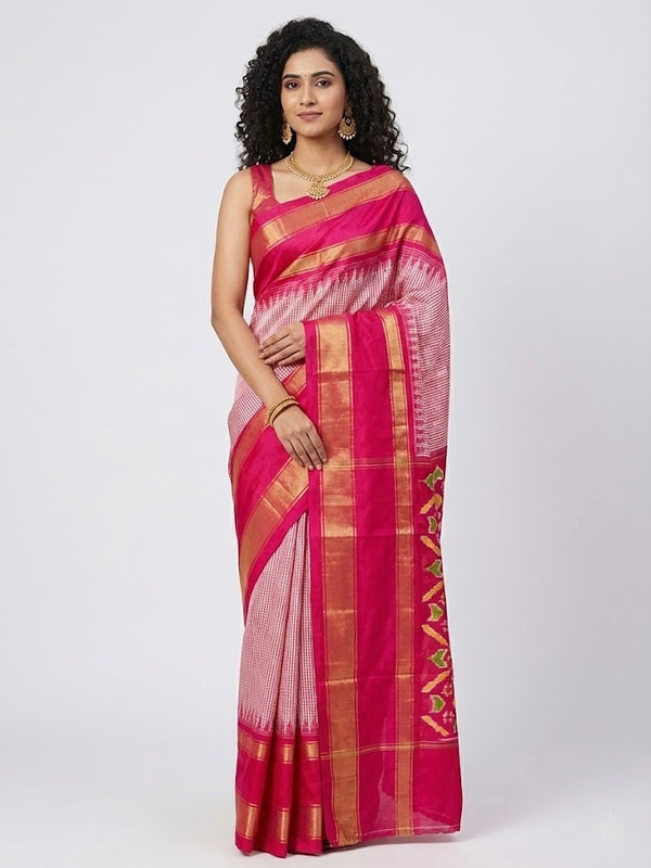 Woman wearing a pink and gold saree on a white background