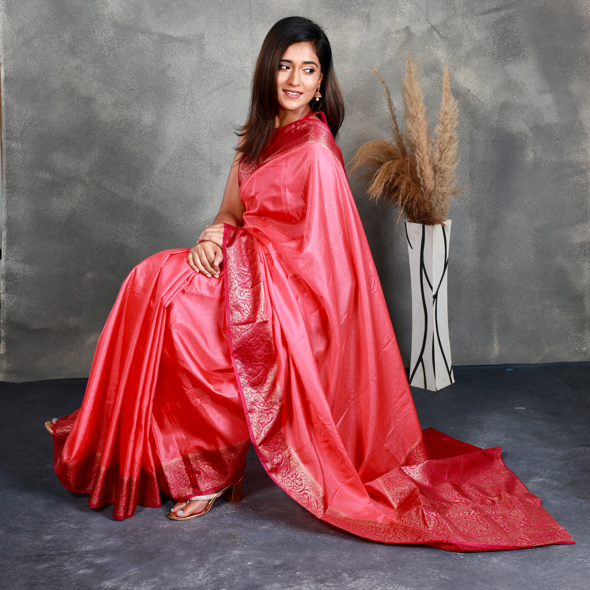 A Pink Saree adorned with a beautiful border - Thugil