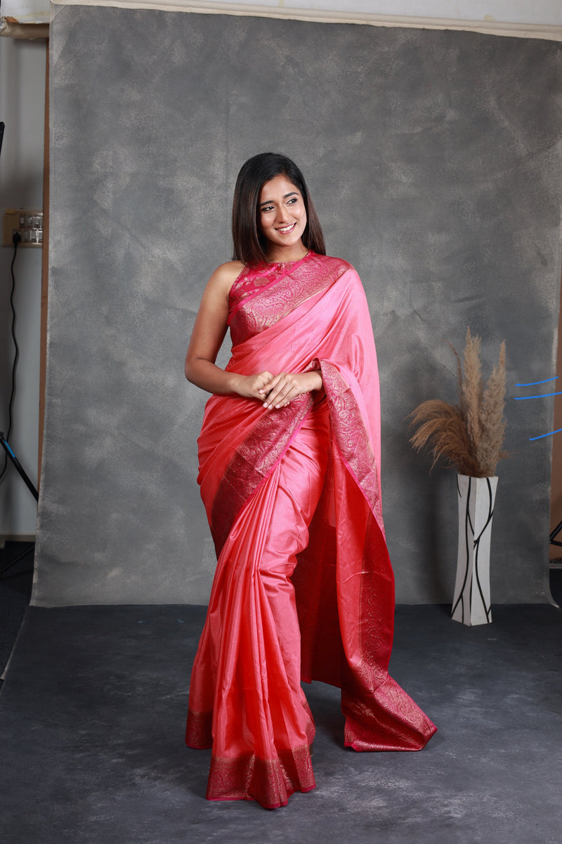 A Pink Saree adorned with a beautiful border - Thugil