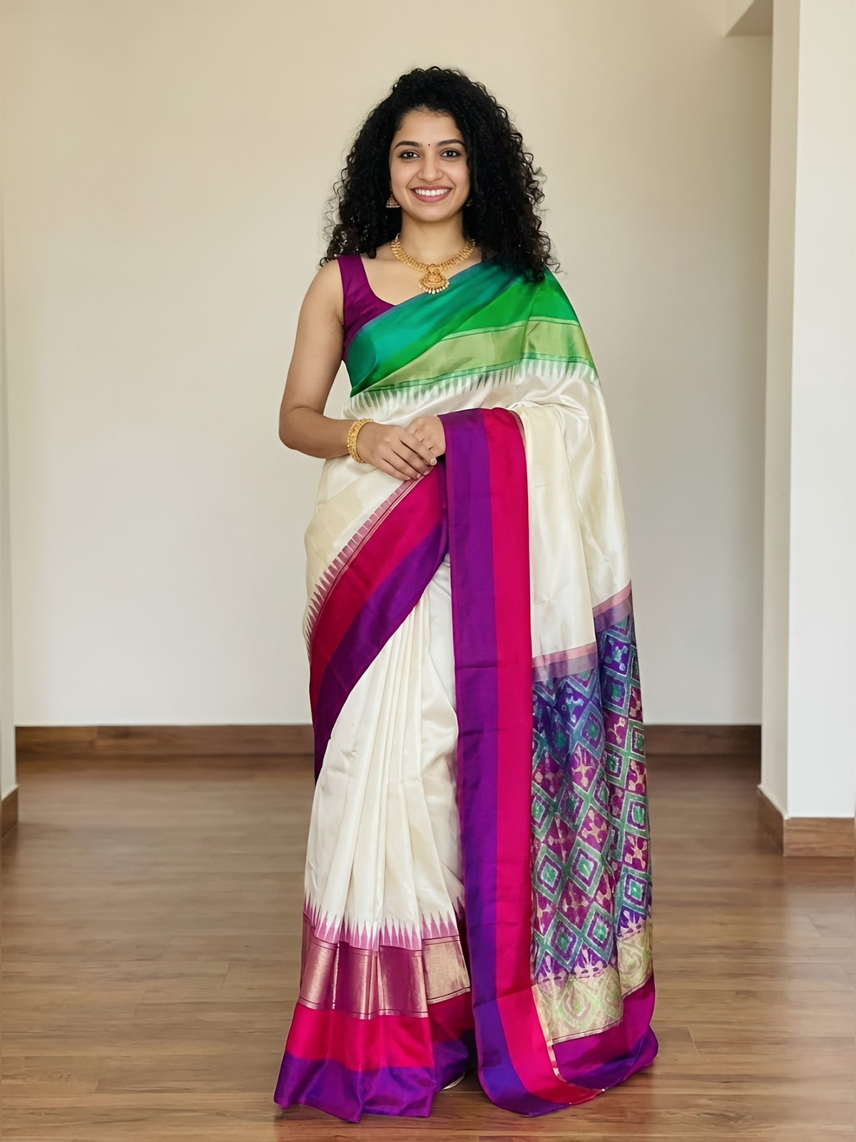 Woman wearing a colorful saree with a white background